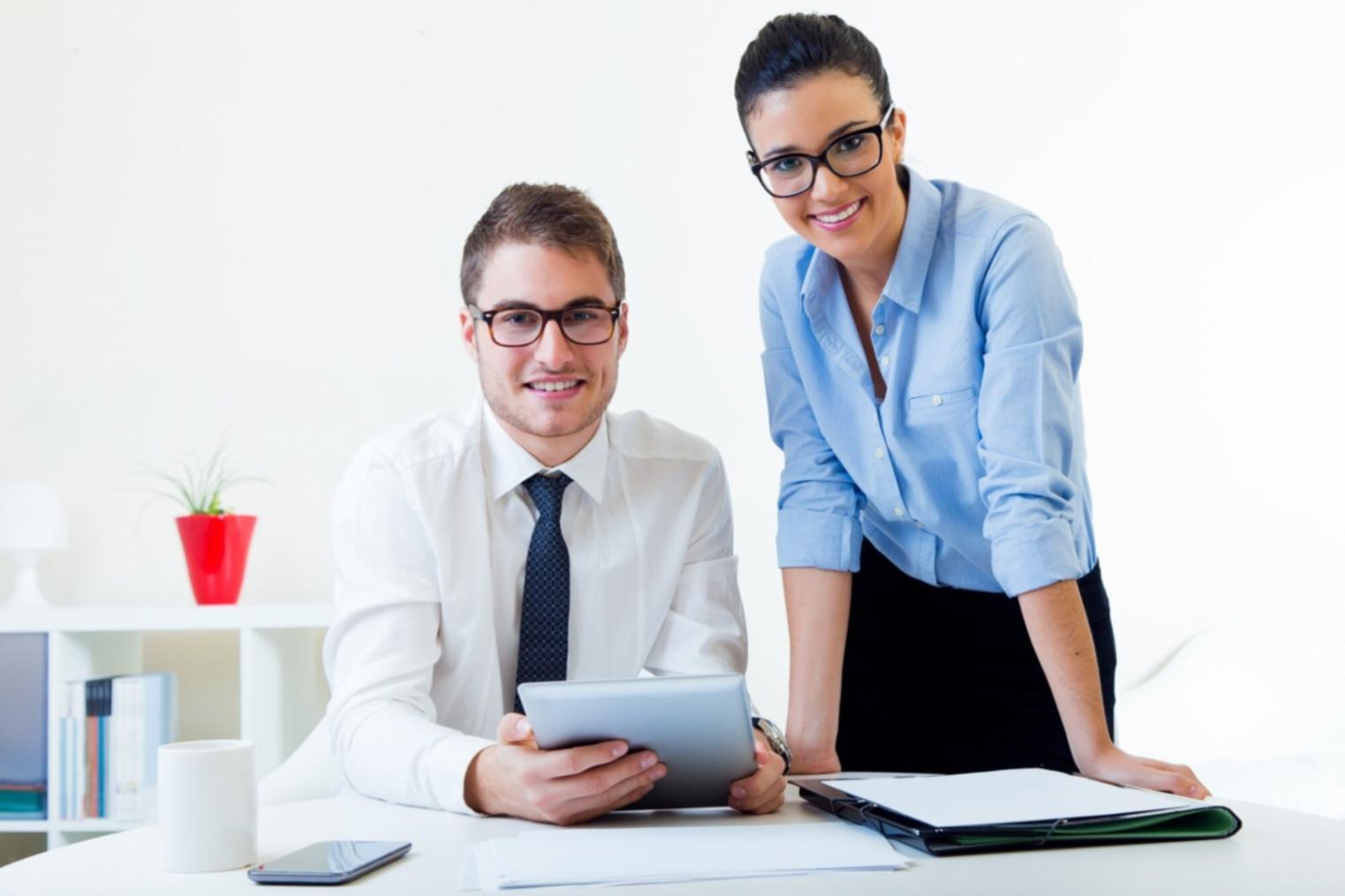 Professional analyzing financial data on multiple screens showing budget projections and cash flow analysis